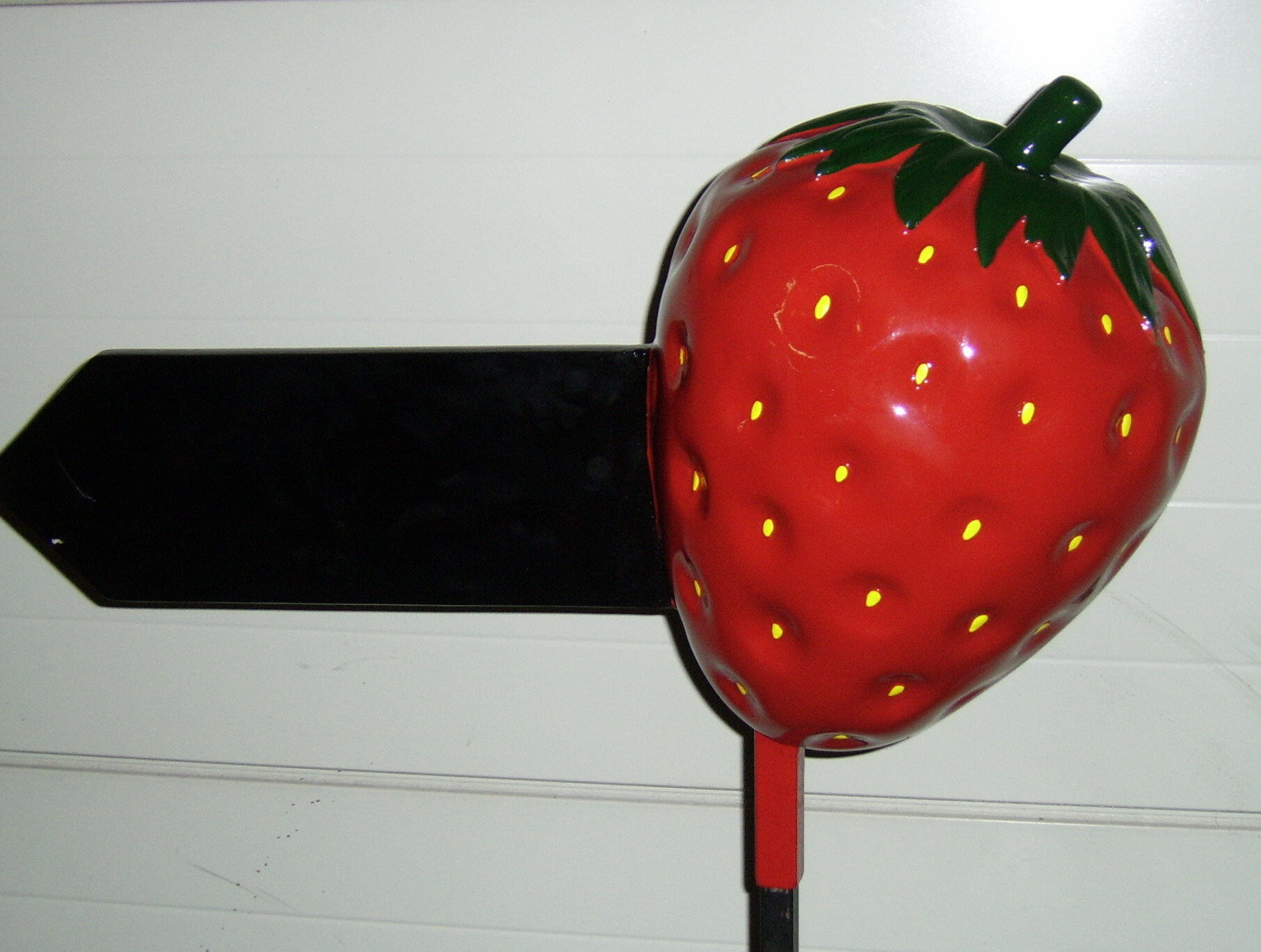 Erdbeere mit Pfeil